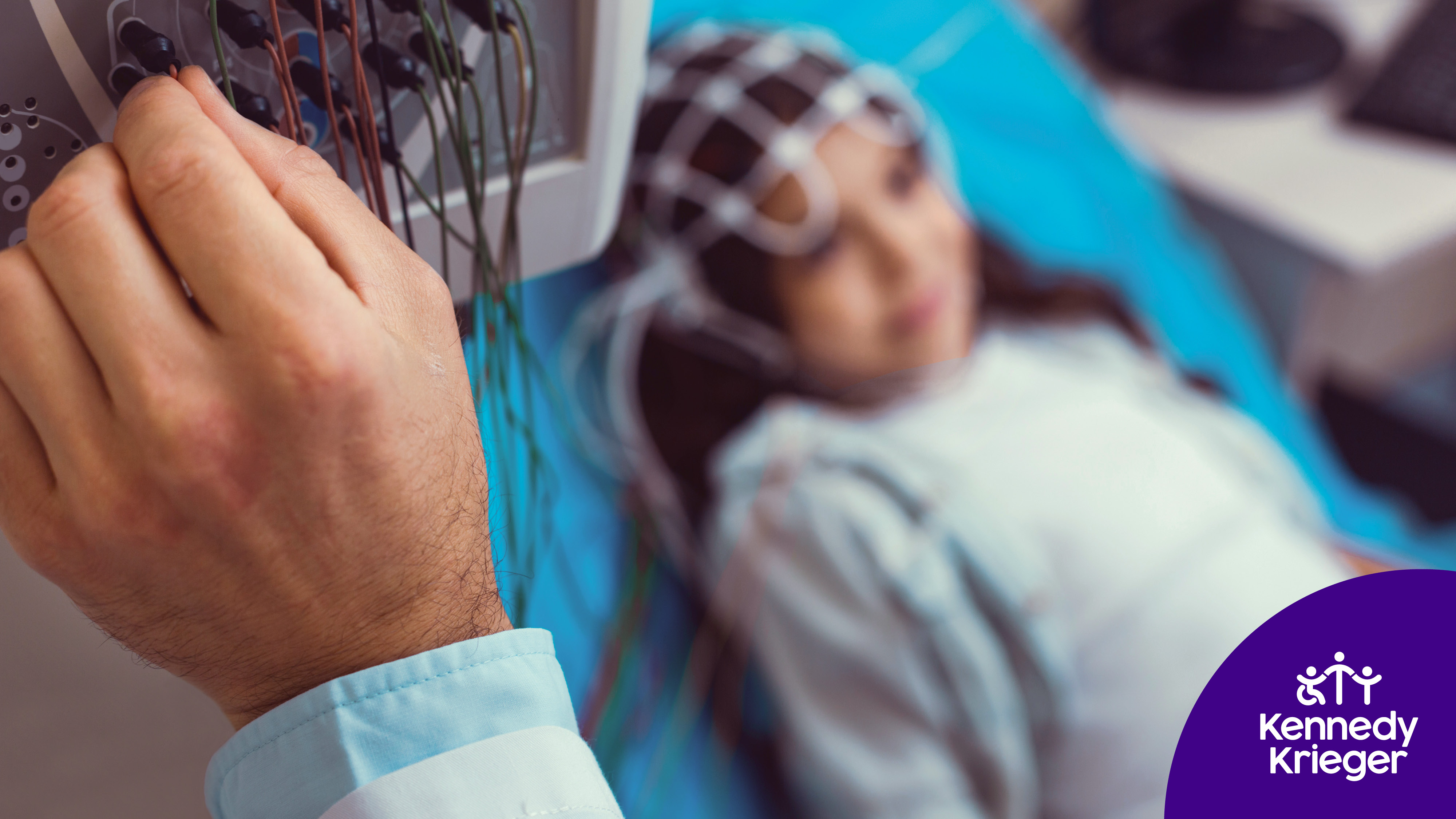 Stock image of a young girl receiving a brain scan.
