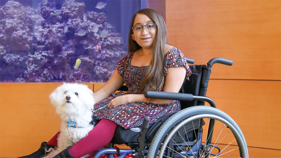 A picture of Shannon with Frosty, her service dog.