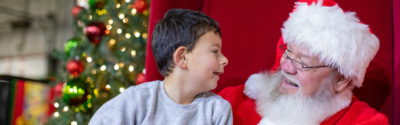 Santa and Child at Festival of Trees