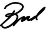 The signature of Brad Schlaggar, President and CEO of Kennedy Krieger