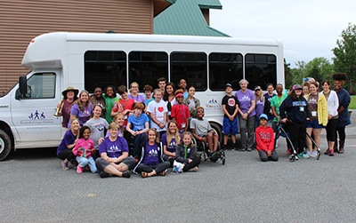 Camp SOAR campers in front of bus