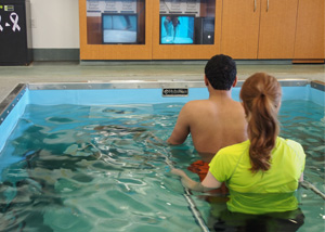 patient and therapist using aquatic treadmill