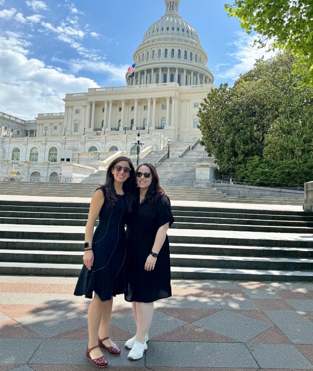 Hannah Wayne and Stacey Herman stand in front of the U.S. Capitol Building.