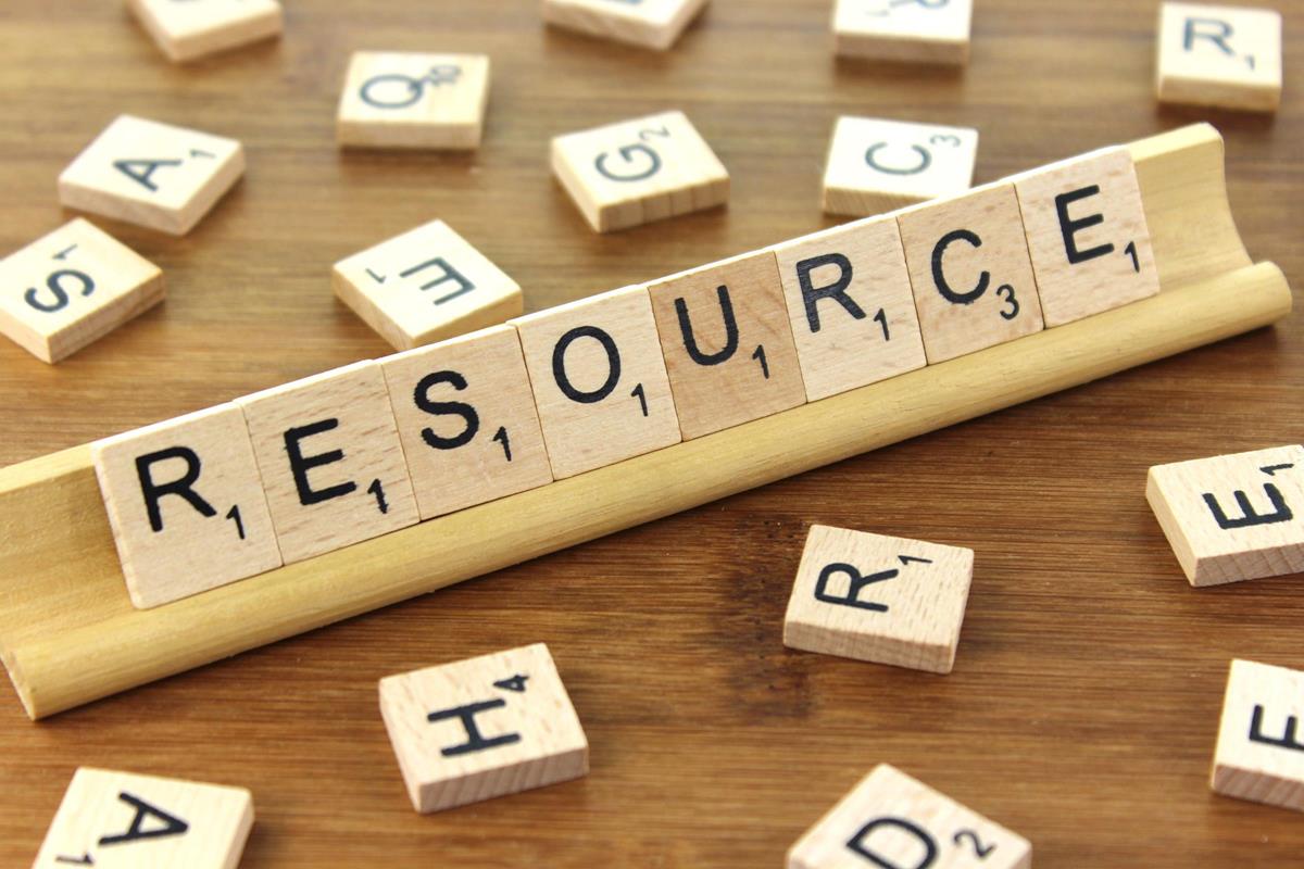 A photo of a Scrabble board, with the pieces spelling out the word "Resource"