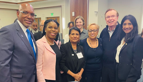 A group of seven people at the event, Interrupting Violence Together: Interfaith Solution Forum,