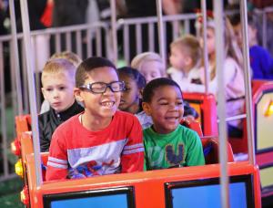 Children enjoy a ride at Festival of Trees.