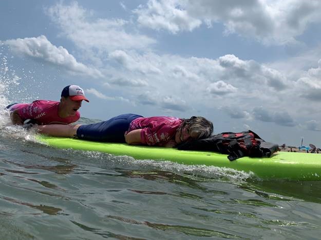 Adaptive sports athletes participate in the Life Rolls On "Get On Board Tour—They Will Surf Again" in Virginia Beach