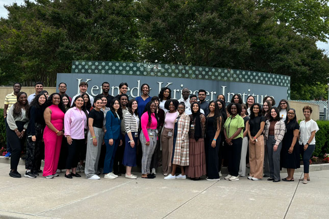 Ferguson RISE scholars gather outside of Kennedy Krieger Institute.