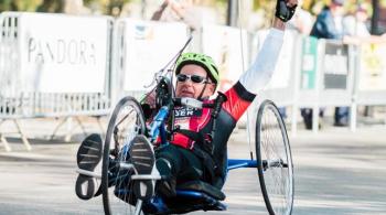 A photo of Jerry, a Kennedy Krieger International Center for Spinal Cord Injury patient, handcycling at the Baltimore Running Festival