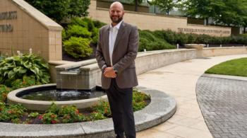Dr. Brad Schlaggar stands in Kennedy Krieger Institute's therapy garden.