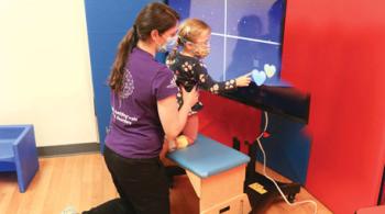 Penny uses PediaCORE with physical therapist Kelsey Wolfe.